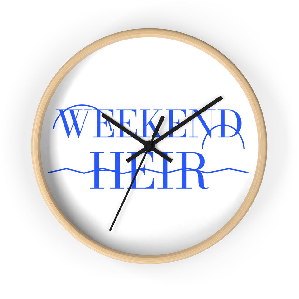 Black | Studio | Weekend Heir Wall Clock, blue wordmark on a white face, natural wood frame, black hands