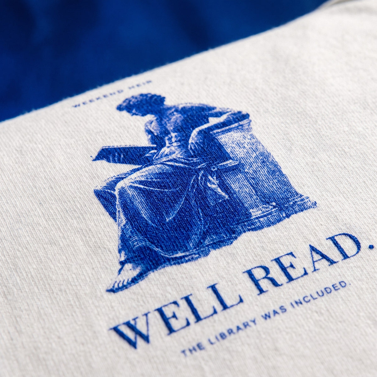 White | Detail | WEEKEND HEIR Well Read Tee in White, the reader engraving up close, the grain of the print